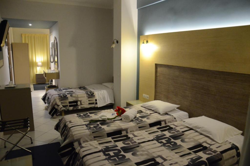 Posteľ alebo postele v izbe v ubytovaní Marie Palace