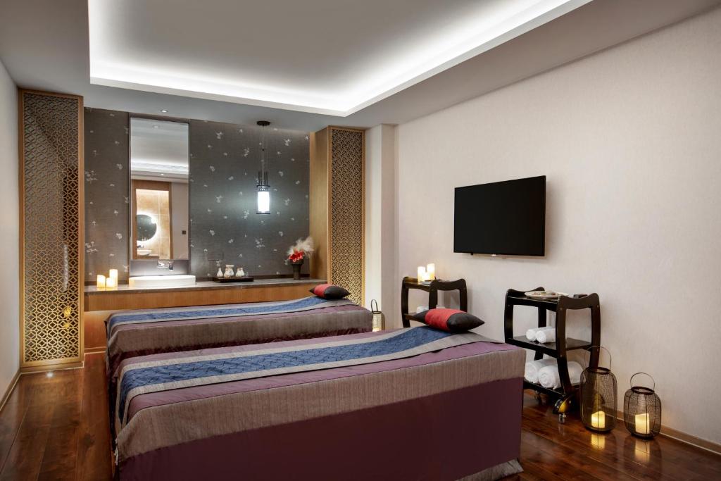 Postel nebo postele na pokoji v ubytování C&D Hotel,Xiamen Xiang'an-Late Check Out & Free Welcome Snacks