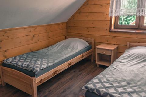 Letto o letti in una camera di WANATÓWKA