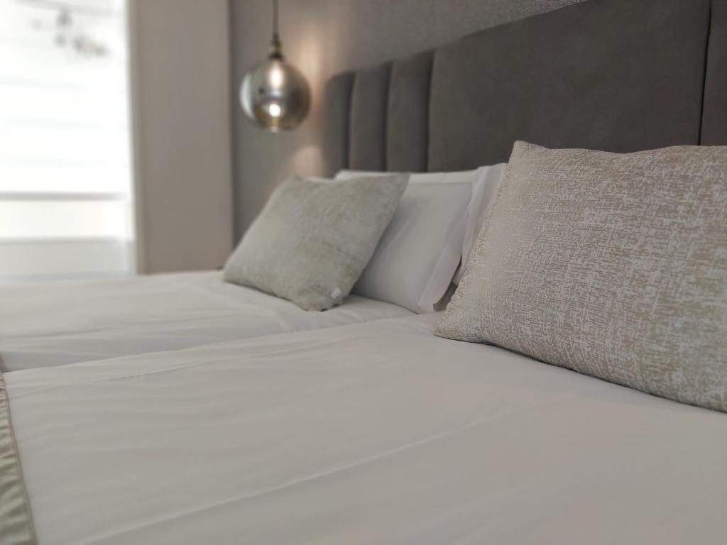 Łóżko lub łóżka w pokoju w obiekcie Del Parque Flats Flores Premium