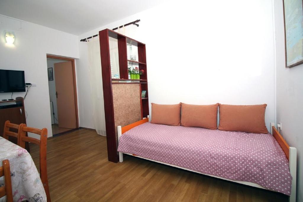 Postel nebo postele na pokoji v ubytování Apartmani Stanko
