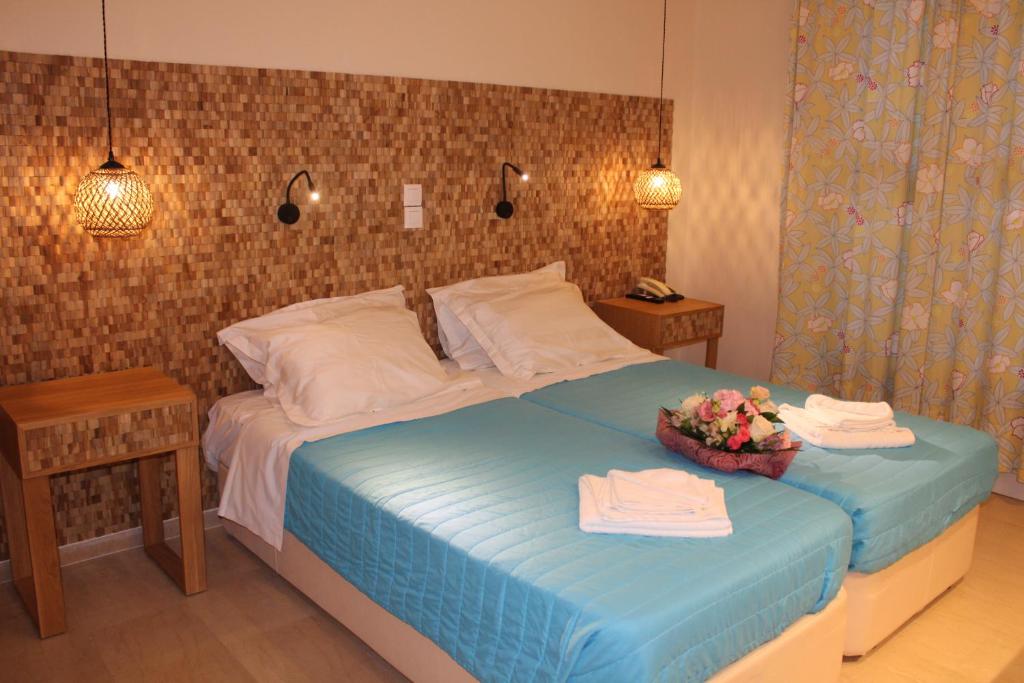 Postel nebo postele na pokoji v ubytování Dassia Beach Hotel