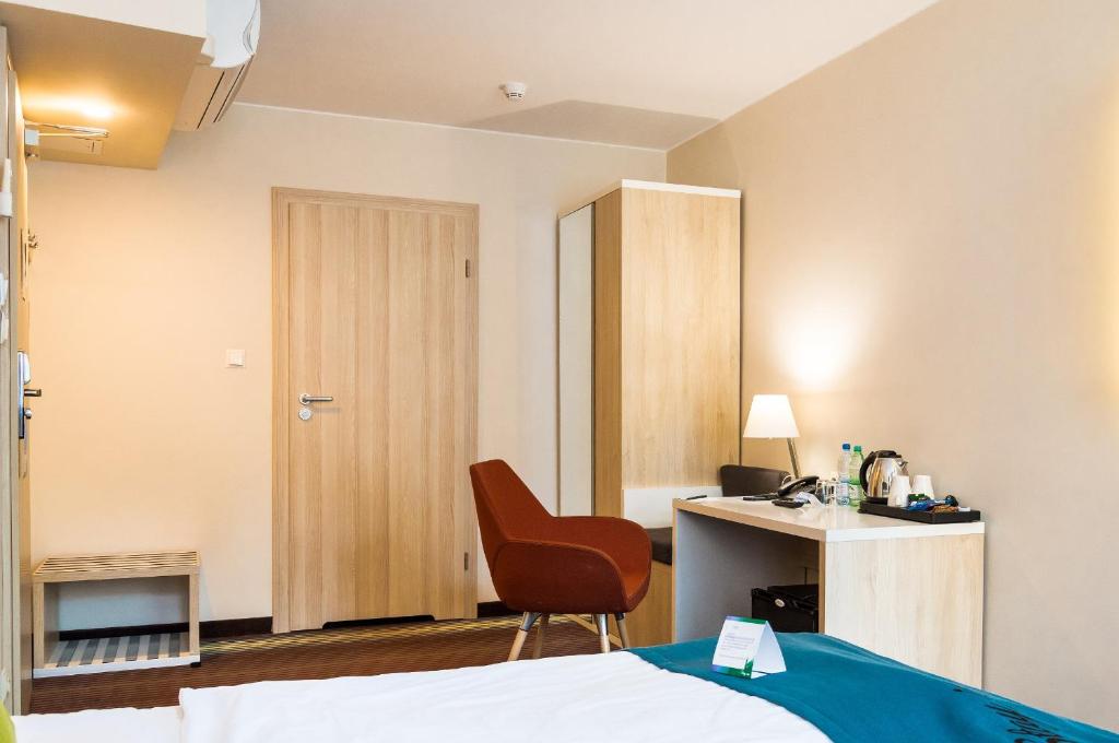 Postel nebo postele na pokoji v ubytování Stay inn Hotel Gdańsk