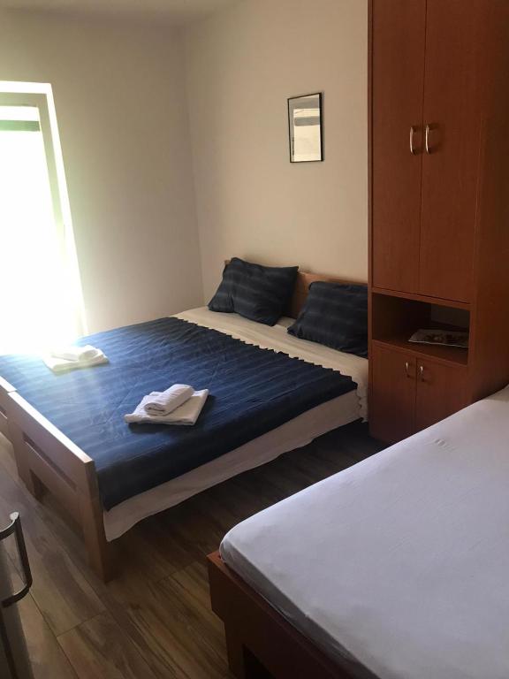 Postel nebo postele na pokoji v ubytování Guesthouse Dupin