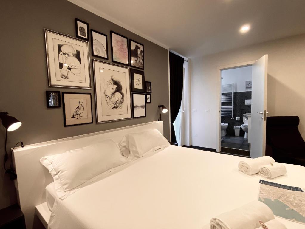 Posteľ alebo postele v izbe v ubytovaní Mimì Rooms&Studios