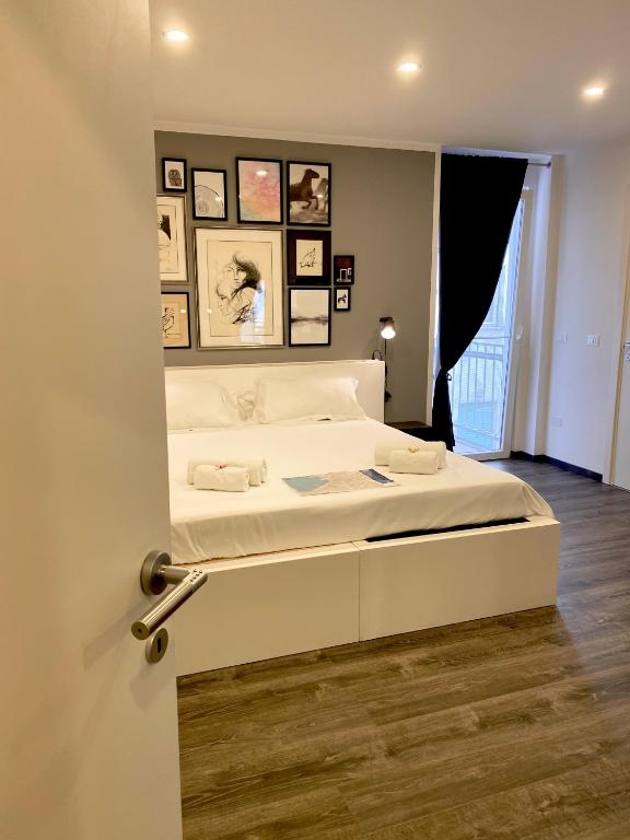 Posteľ alebo postele v izbe v ubytovaní Mimì Rooms&Studios