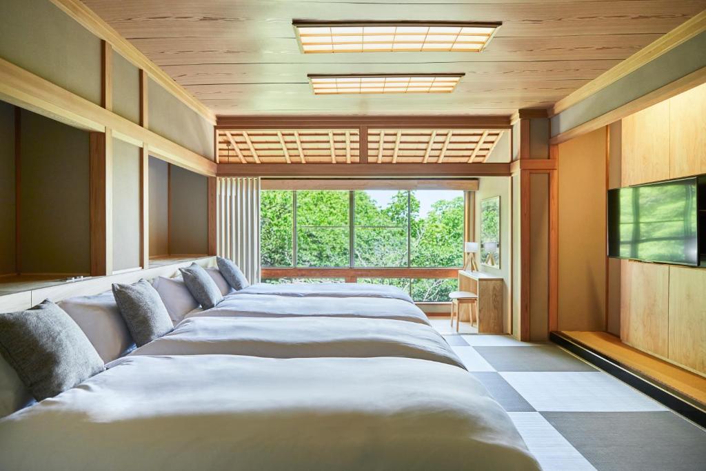 Postel nebo postele na pokoji v ubytování ANDO HOTEL NARA Wakakusayama -DLIGHT LIFE & HOTELS-