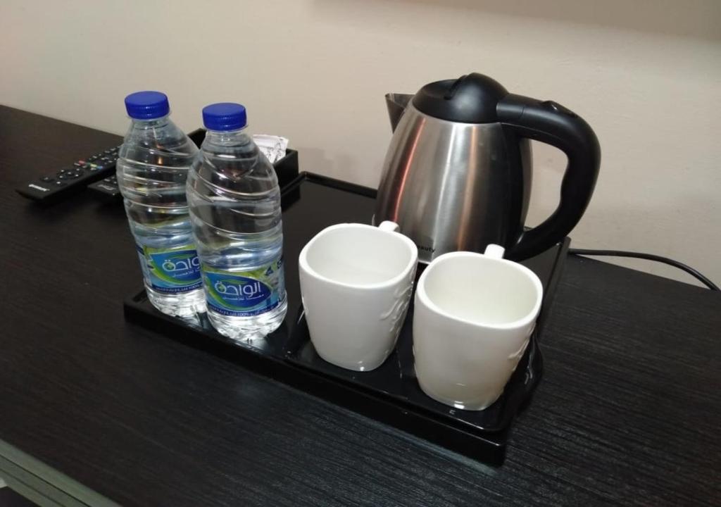 Příslušenství pro přípravu čaje a kávy v ubytování Tanuf Residency Hotel