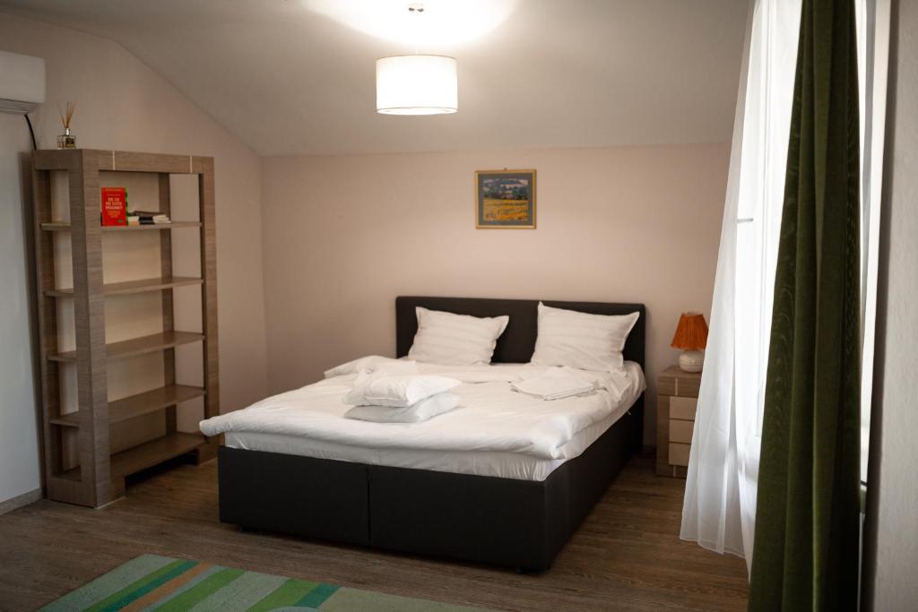 Postel nebo postele na pokoji v ubytování Vikings Grigo Apartaments