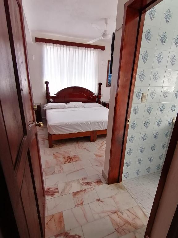 Postel nebo postele na pokoji v ubytování Don Luis Hostal - Sucursal Hidalgo - Tecolutla