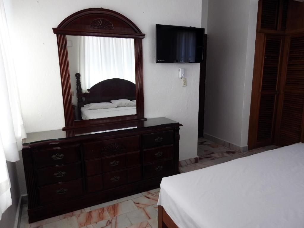 Postel nebo postele na pokoji v ubytování Don Luis Hostal - Sucursal Hidalgo - Tecolutla