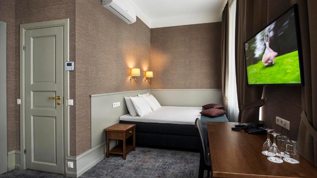 TV a/nebo společenská místnost v ubytování Hestia Hotel Barons Old Town