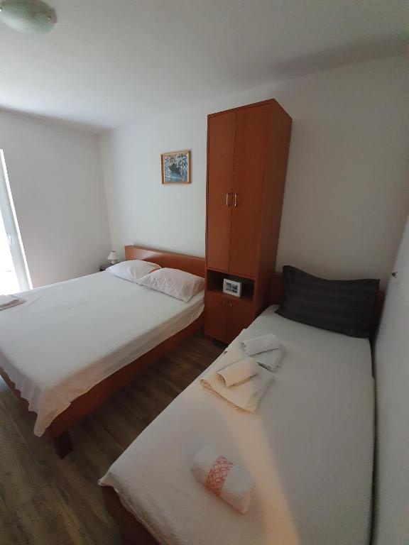 Postel nebo postele na pokoji v ubytování Guesthouse Dupin