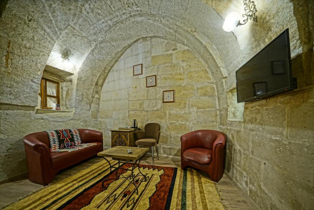 TV a/nebo společenská místnost v ubytování Cappadocia Fairy Tale Suites