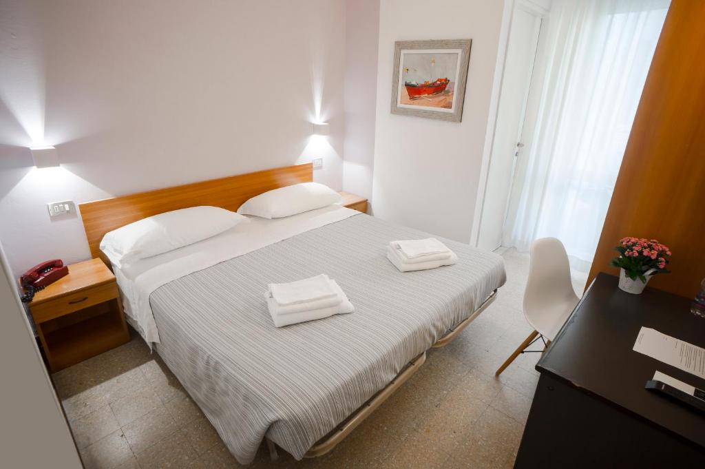 Postel nebo postele na pokoji v ubytování Hotel Mon Pays