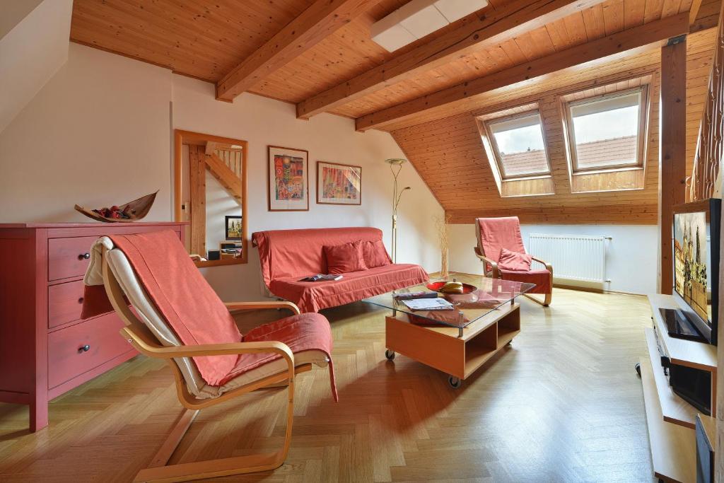 a living room with a couch and a table at Old Town Apartments Tyn in Prague