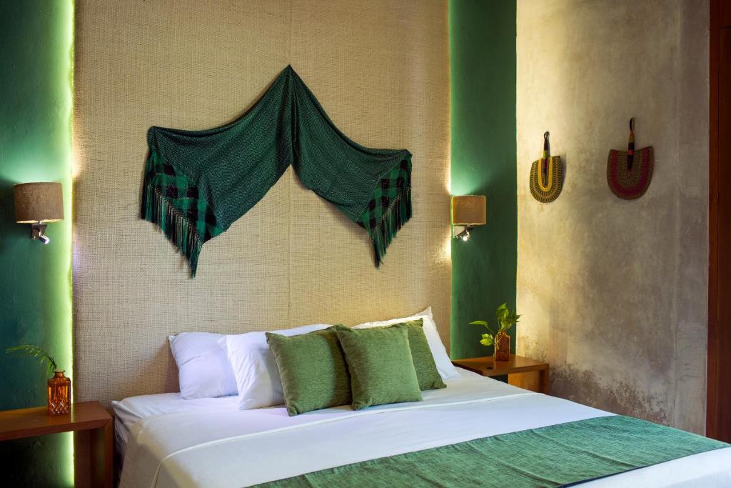 Postel nebo postele na pokoji v ubytování Ya'ax Hotel Boutique