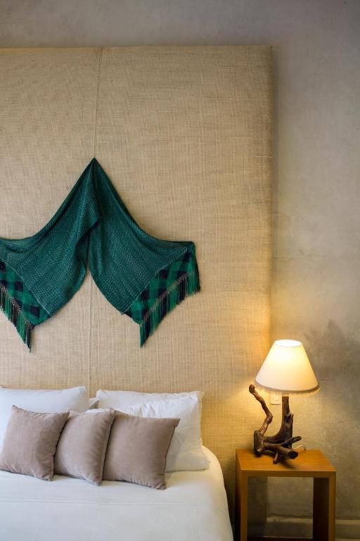 Postel nebo postele na pokoji v ubytování Ya'ax Hotel Boutique