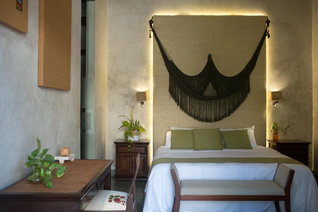 Postel nebo postele na pokoji v ubytování Ya'ax Hotel Boutique