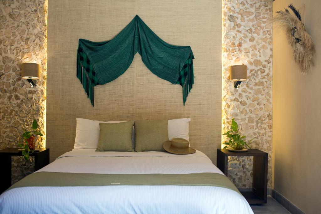 Postel nebo postele na pokoji v ubytování Ya'ax Hotel Boutique