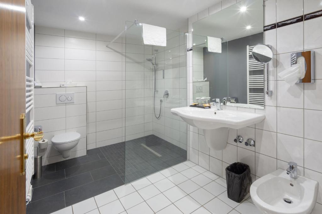 Koupelna v ubytování SL'otel im Parforcehaus