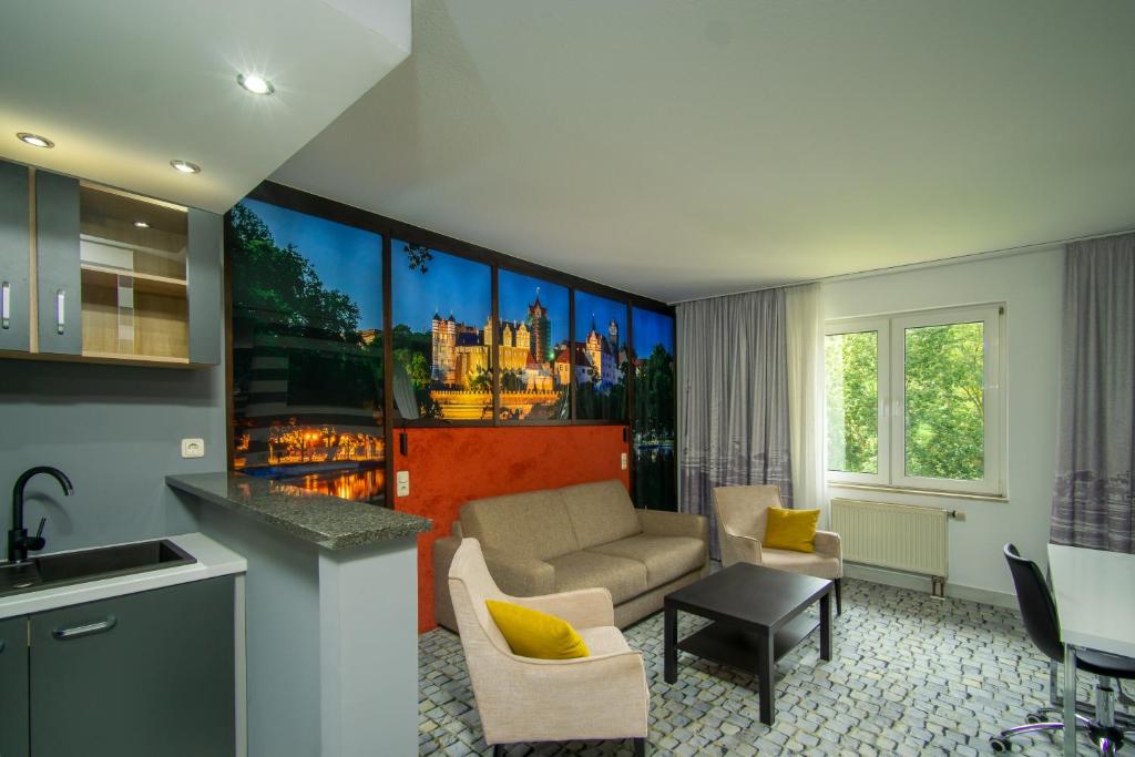Posezení v ubytování SL'otel im Parforcehaus
