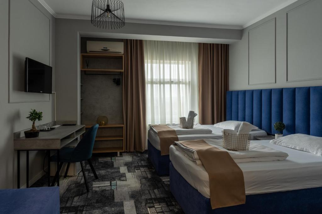 Postel nebo postele na pokoji v ubytování Hotel PASO