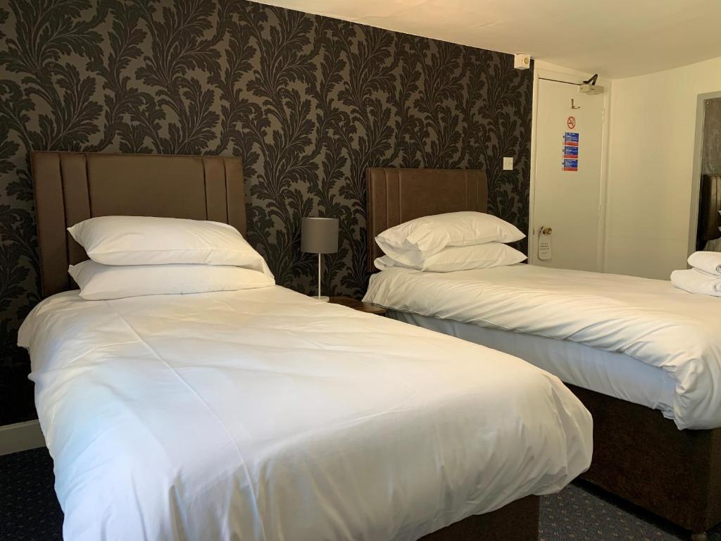 Postel nebo postele na pokoji v ubytování Castle Hotel