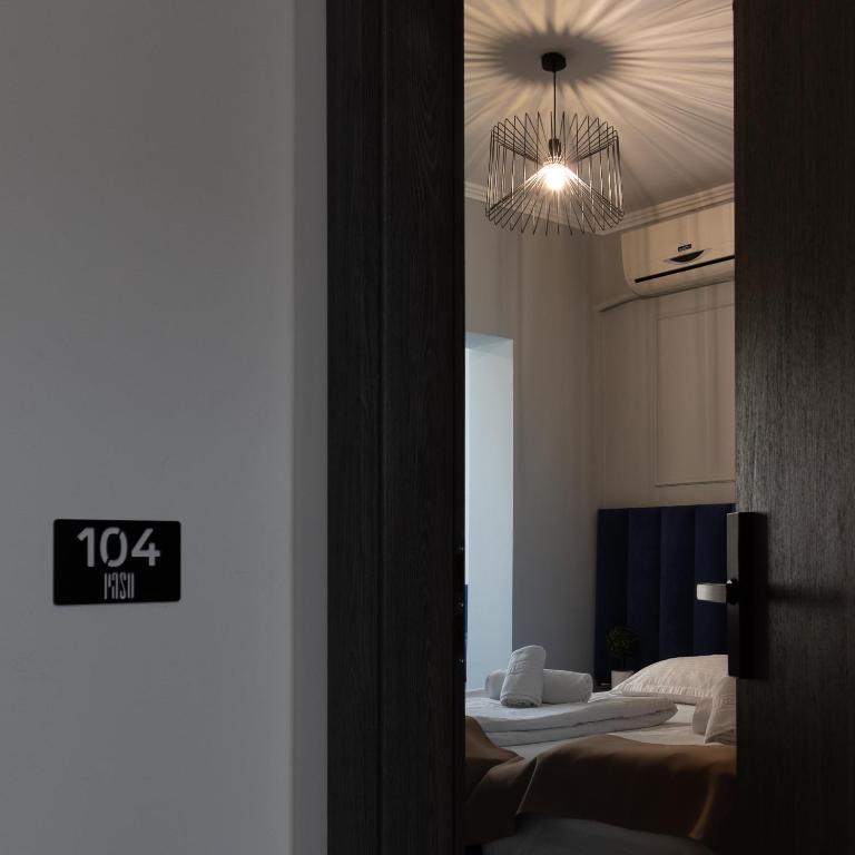 Postel nebo postele na pokoji v ubytování Hotel PASO
