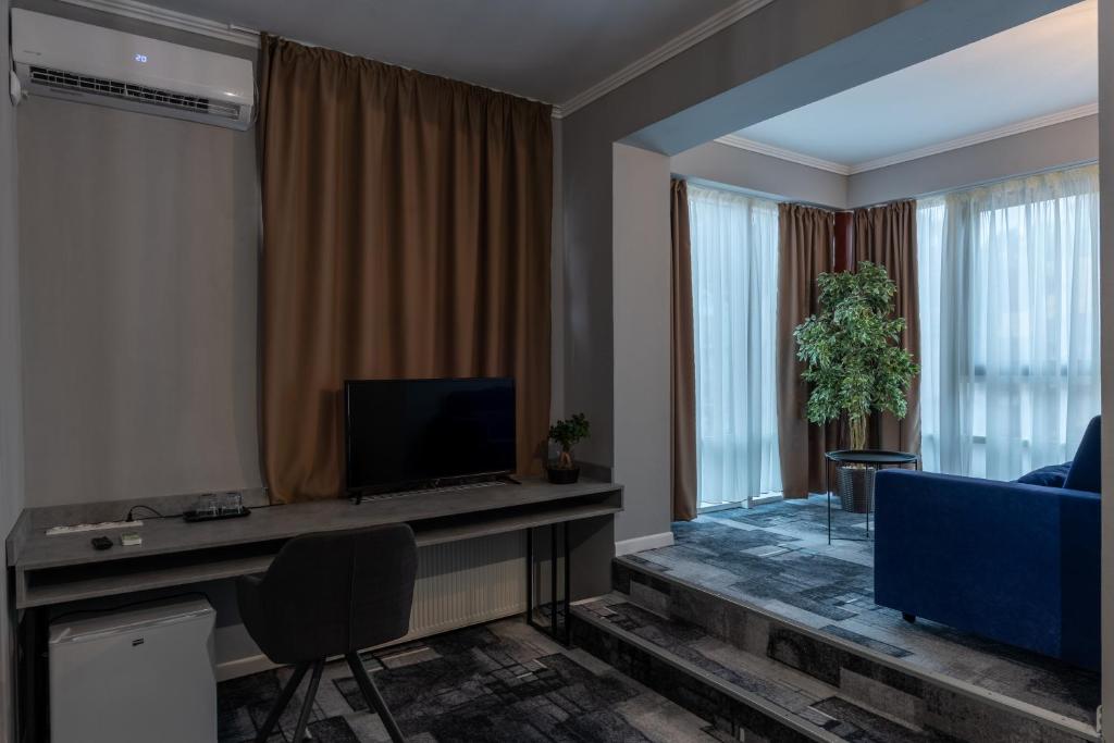 TV a/nebo společenská místnost v ubytování Hotel PASO