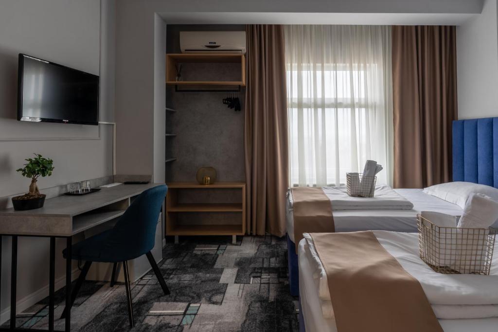 TV a/nebo společenská místnost v ubytování Hotel PASO