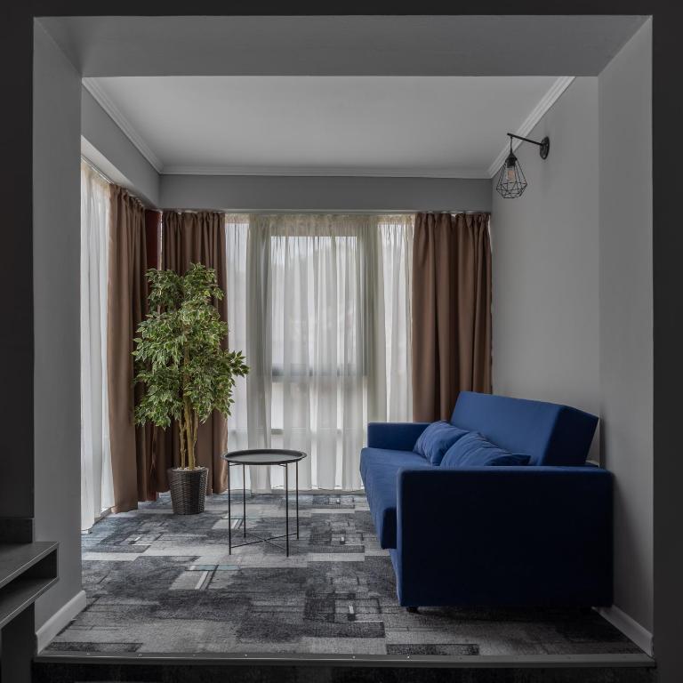 Posezení v ubytování Hotel PASO