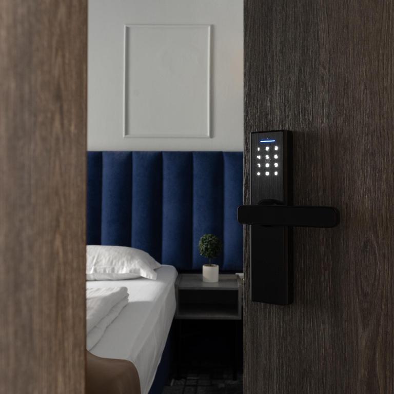 Postel nebo postele na pokoji v ubytování Hotel PASO