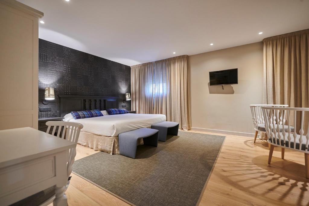 Postel nebo postele na pokoji v ubytování Hostal Lola