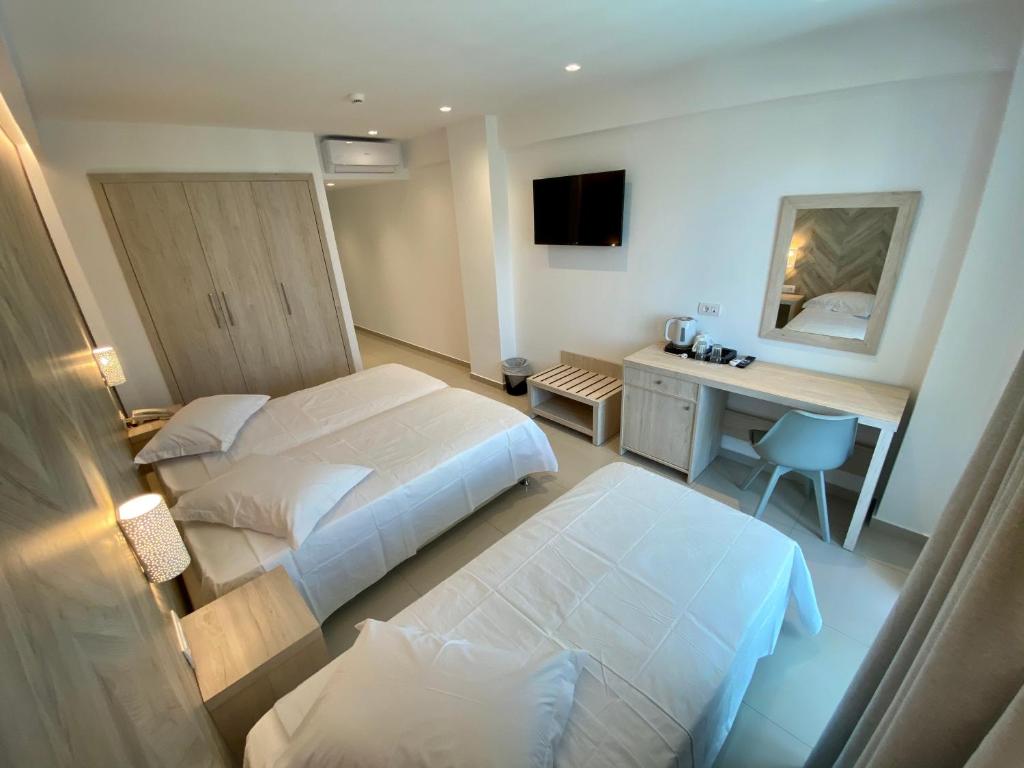 Postel nebo postele na pokoji v ubytování Agrelli Hotel & Suites