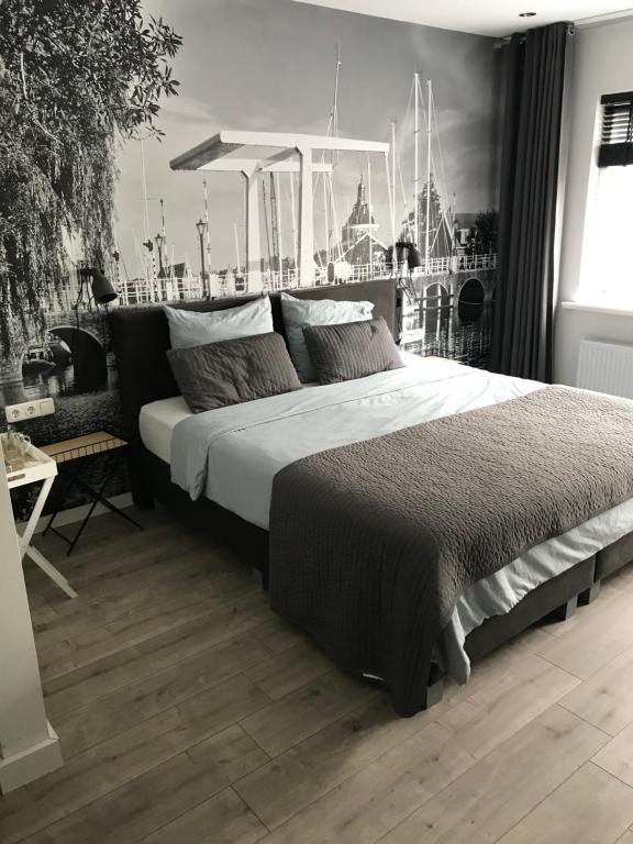 Tempat tidur dalam kamar di Appartement Aan de Veste