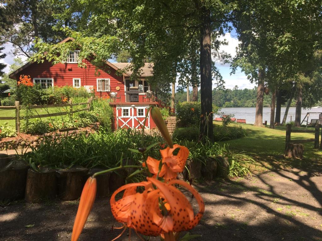an orange pumpkin statue in front of a house at Rainbow's End Resort Camp in Chetek
