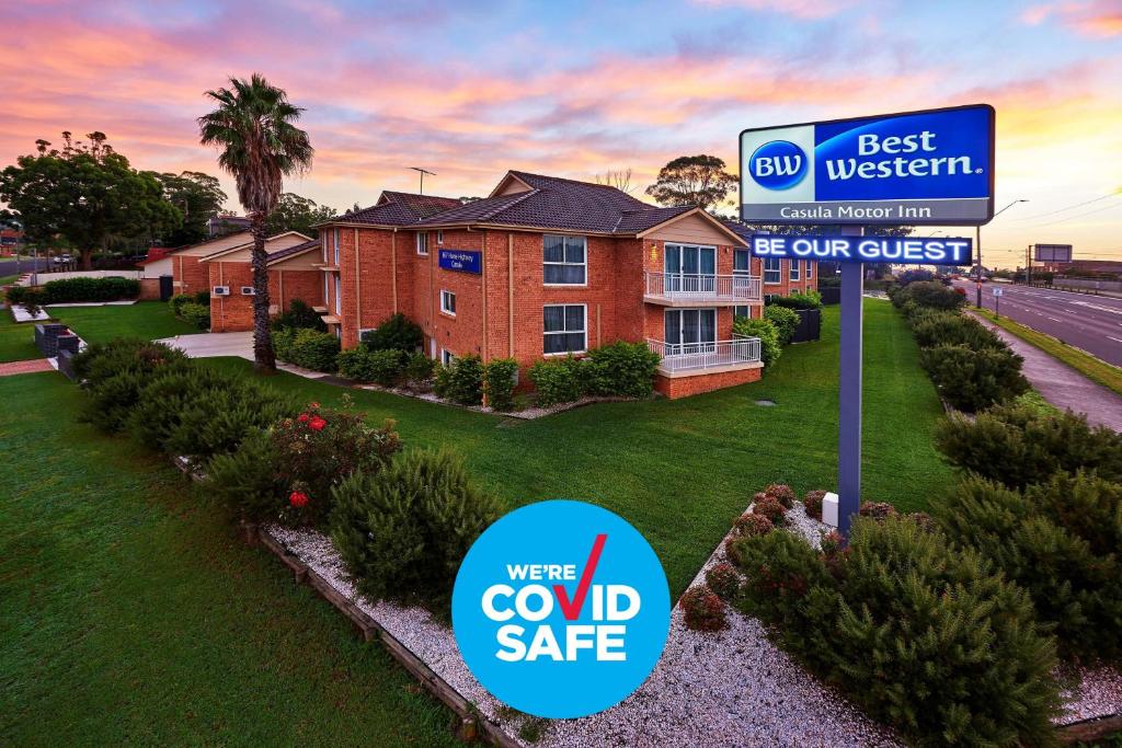 a house with a sign in front of it at Best Western Casula Motor Inn in Liverpool