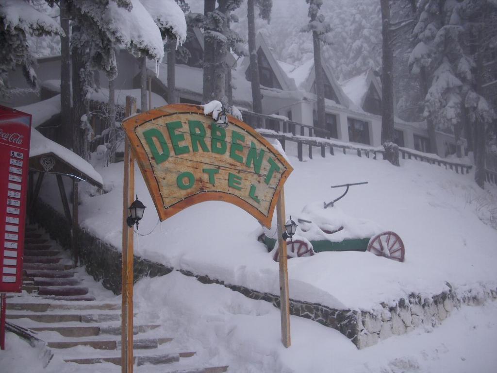 a sign for a garden office in the snow at Ilgaz Derbent Hotel in Ilgaz