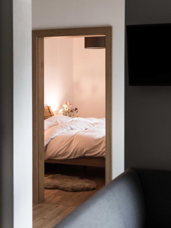 Postel nebo postele na pokoji v ubytování Gästehaus Erika - by myNests