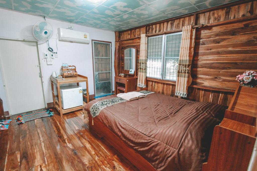 Postel nebo postele na pokoji v ubytování Akchanok Homestay