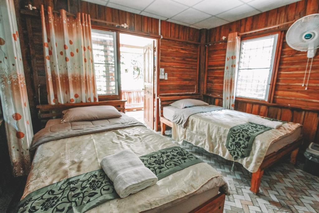 Postel nebo postele na pokoji v ubytování Akchanok Homestay