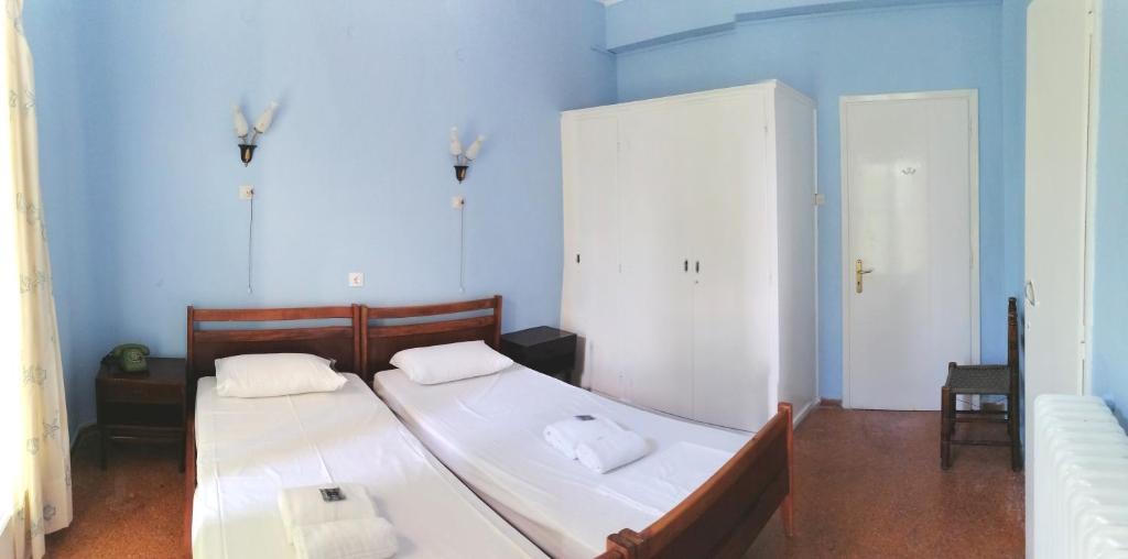 Postel nebo postele na pokoji v ubytování Nireus Hotel