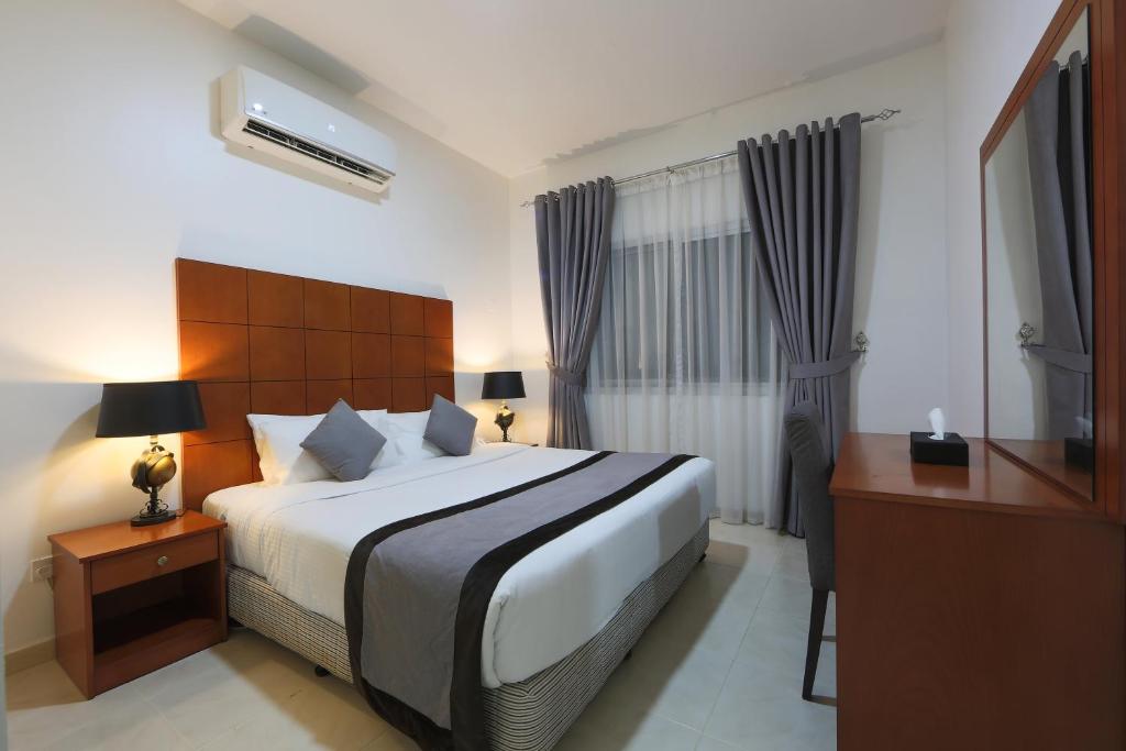 Postel nebo postele na pokoji v ubytování Nova Park Hotel
