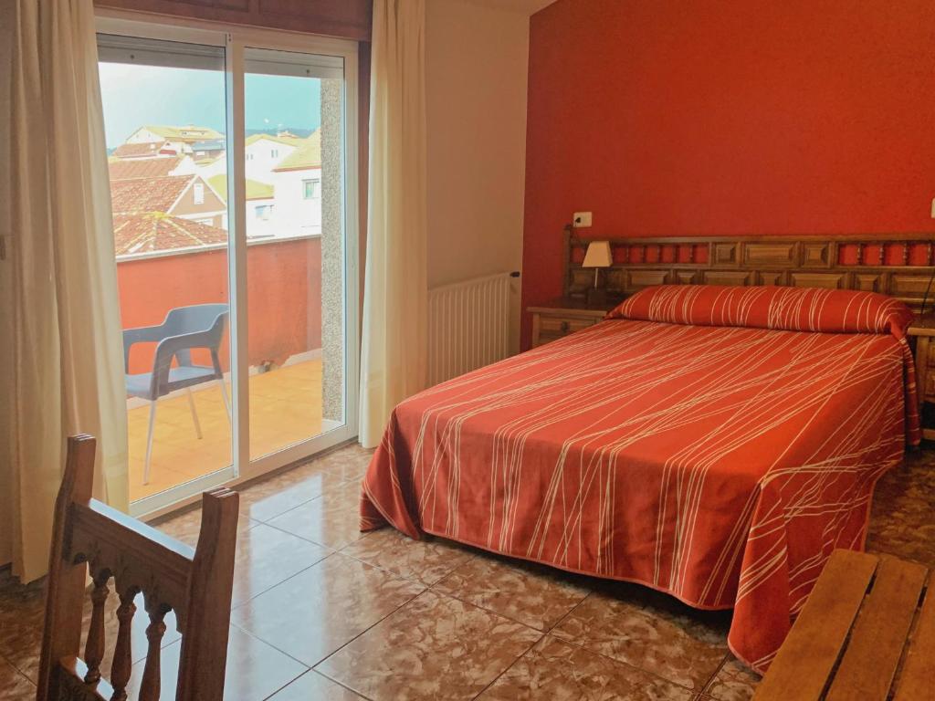Łóżko lub łóżka w pokoju w obiekcie Hostal Las Vegas