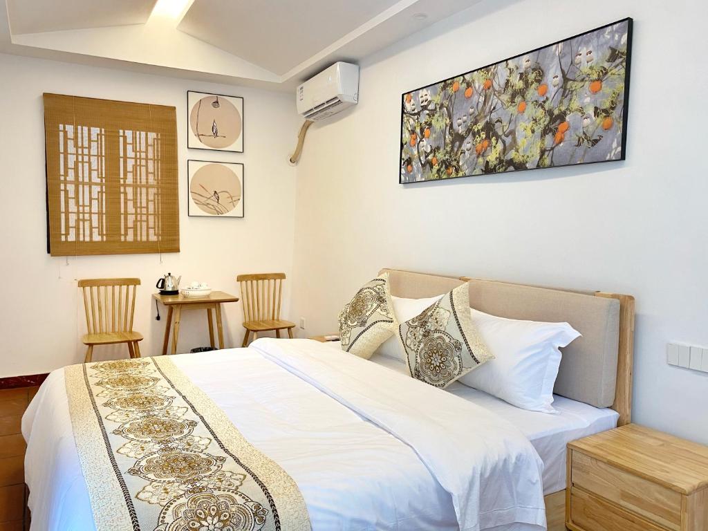 Postel nebo postele na pokoji v ubytování Chaozhou Hello Inn