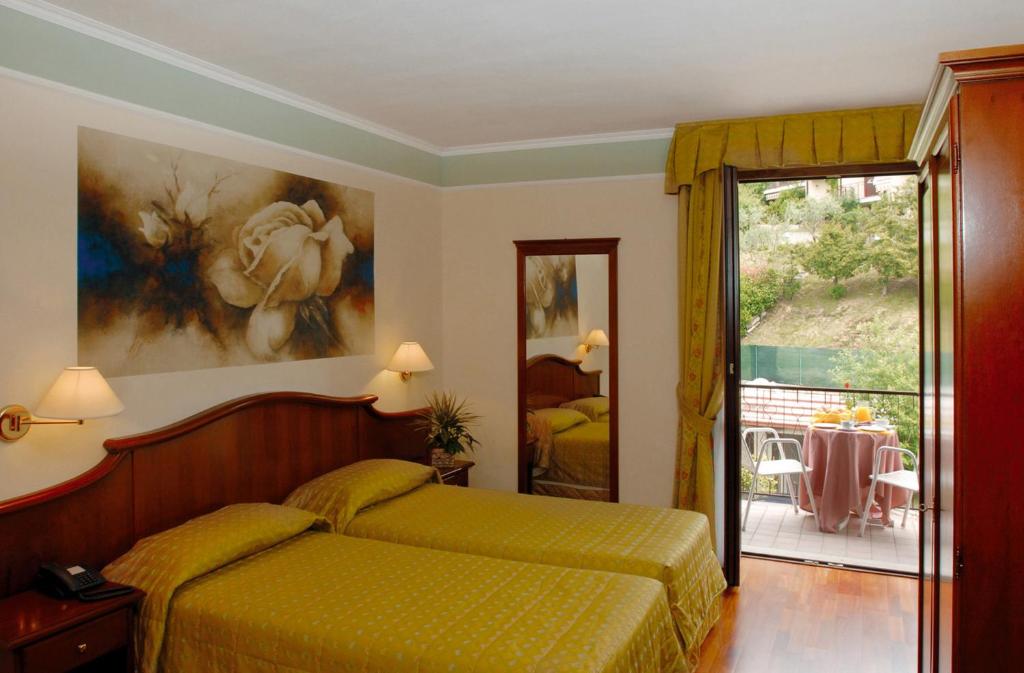 Postel nebo postele na pokoji v ubytování Hotel Astra