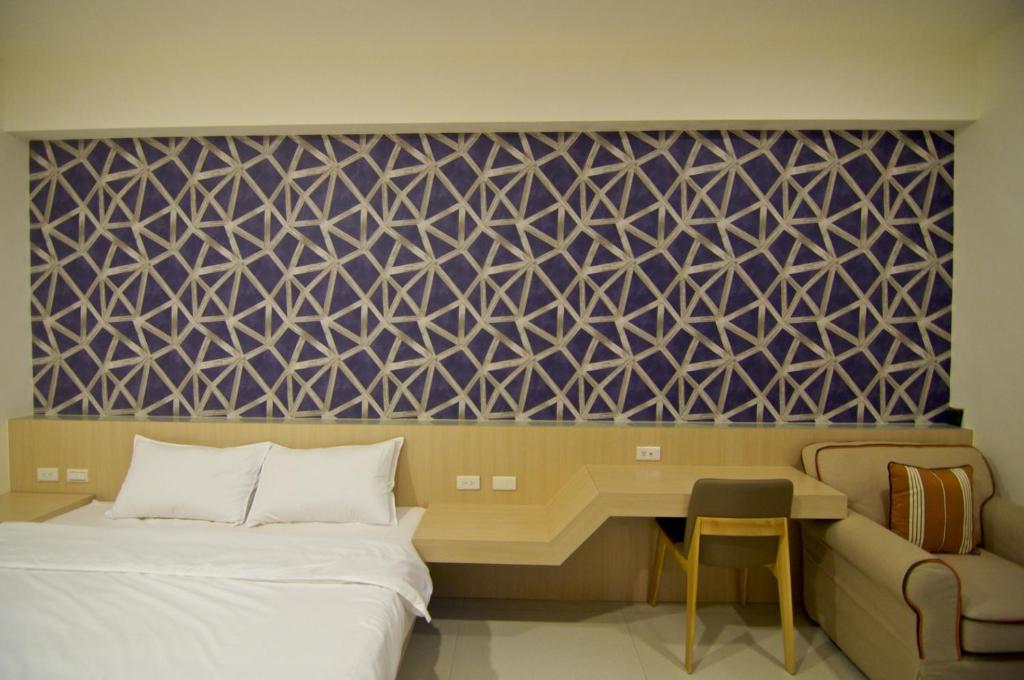 Postel nebo postele na pokoji v ubytování Ai's Inn