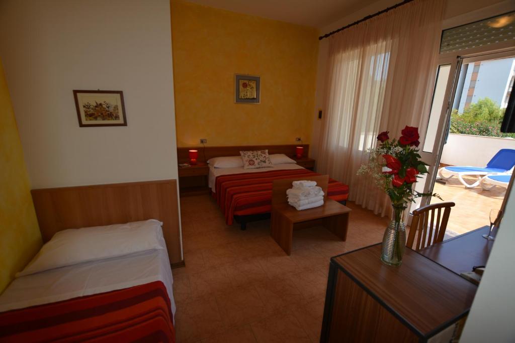 Postel nebo postele na pokoji v ubytování Hotel Nuova Graziosa