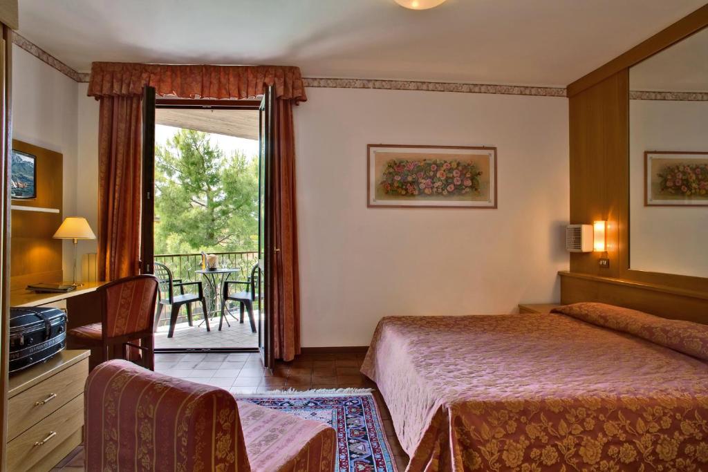 Postel nebo postele na pokoji v ubytování Hotel Astra
